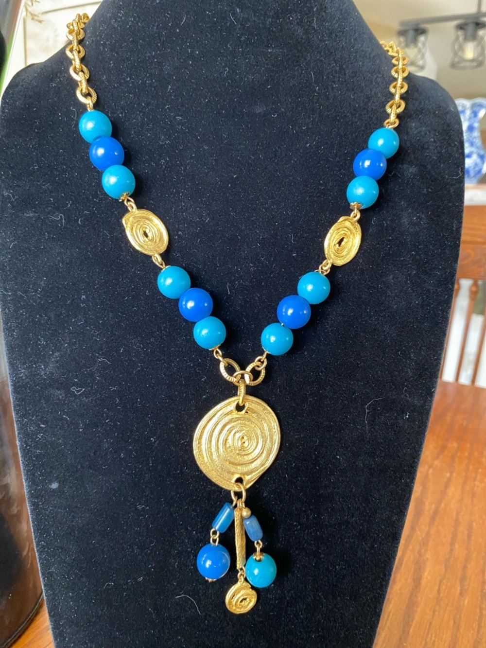 Carol Dauplaise Matte Gold Spiral Pendant Necklace with Blue Beads